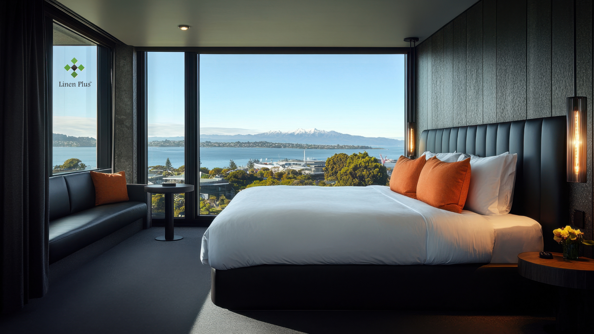 Crisp white hotel bed linens in a modern Canadian hotel room